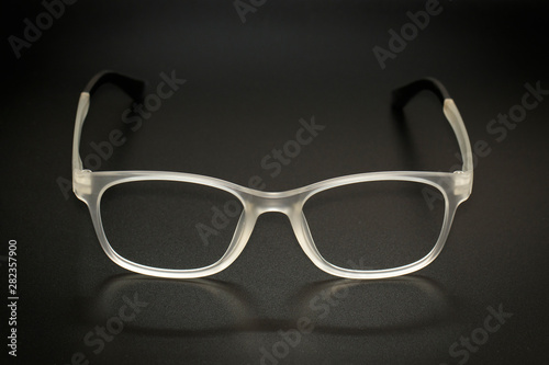 Image of modern fashionable spectacles isolated on black background, Eyewear, Glasses