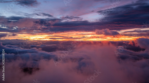 Foggy autumn landscape. Colorful fog and mountains on morning sky background. sunrise © max_play
