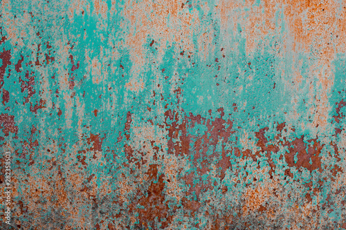 Surface of old rusty metal sheet coated with corrosion