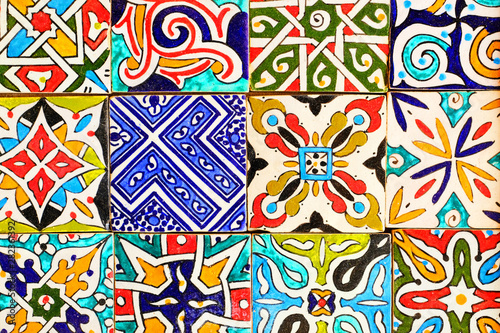 Colorful ornamental tiles at moroccan courtyard, close-up view of mosaic wall