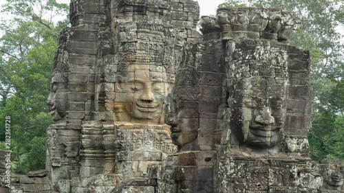 four large stone faces at bayon temple