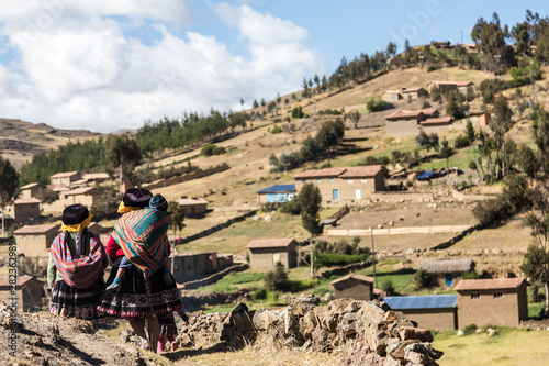 Andeans women's return to your community at the peruvian andes photo
