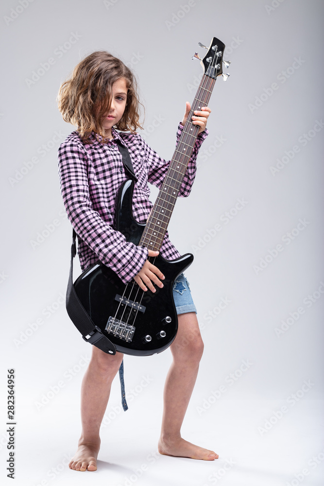 Full length talented girl playing electric guitar Full length talented girl playing electric guitar