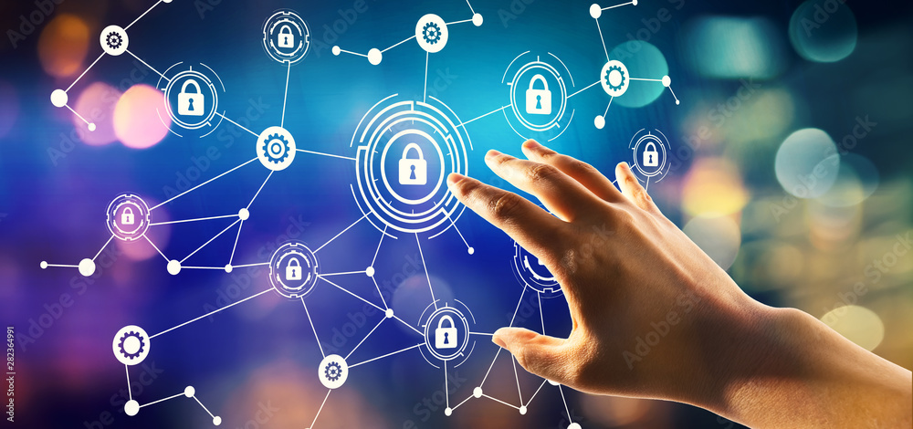 Cyber security theme with hand pressing a button on a technology screen Cyber security theme with hand pressing a button on a technology screen
