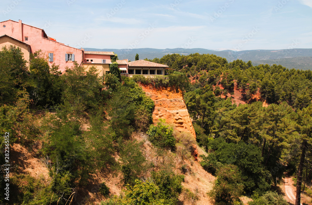 Roussillon, red rocks colorful ochre canyon in Provence, landscape of France.