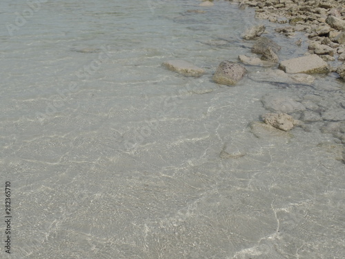 Stones and sand on Fuwairit Beach in Qatar photo