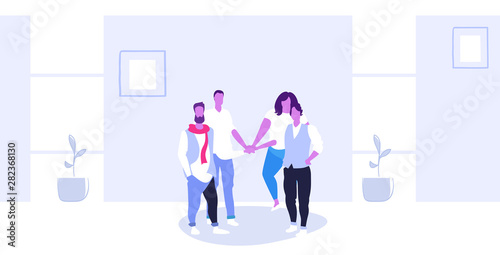 businesspeople group collaborating holding pile hands team spirit concept business people standing together teamwork modern office interior sketch horizontal full length