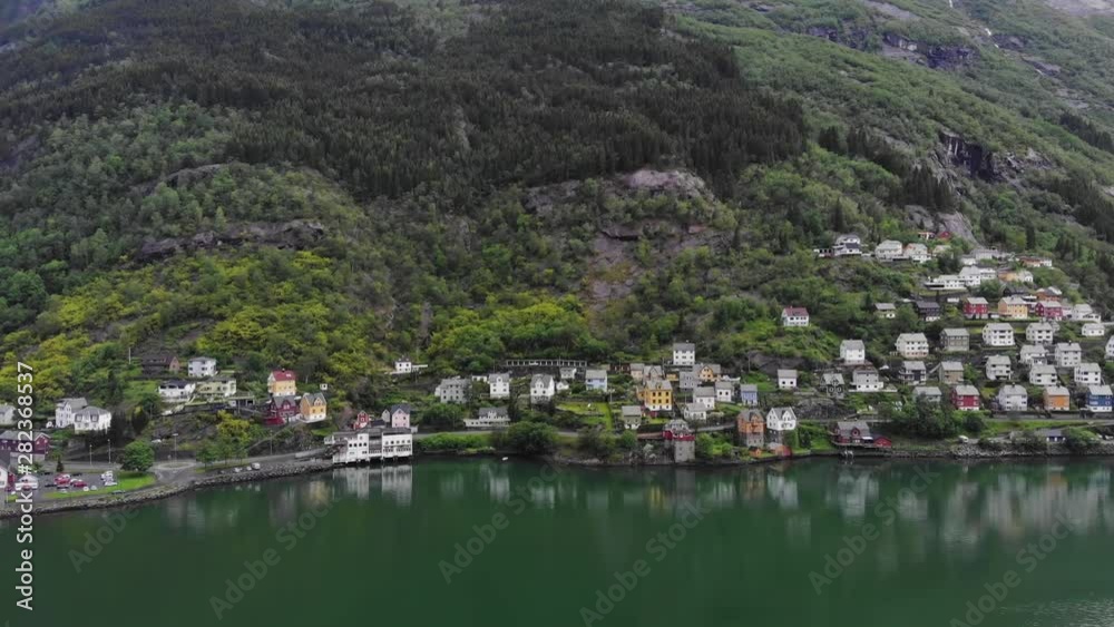 Beautiful aerial pan shot of houses down the hill during summer Beautiful aerial pan shot of houses down the hill during summer