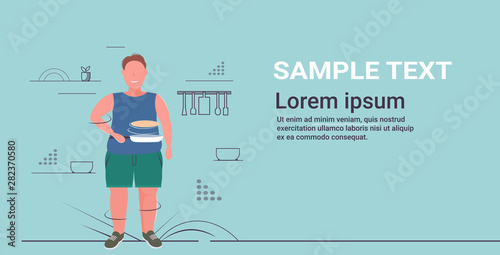 fat obese man preparing fresh pancakes in frying pan unhealthy nutrition obesity concept overweight guy standing pose flat full length horizontal copy space