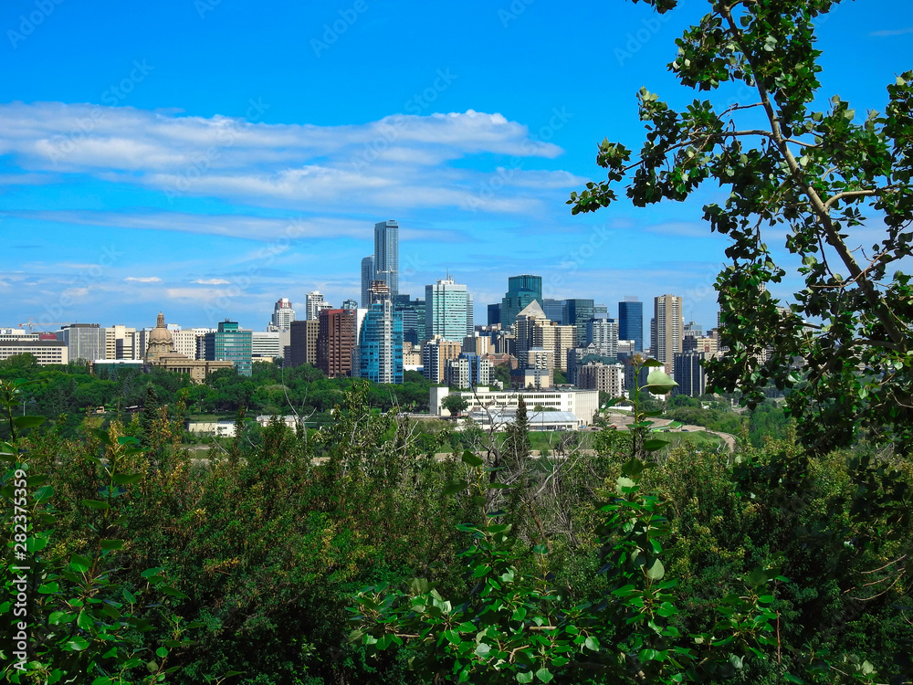 Stunning view of downtown Edmonton, Alberta, Canada. Taken on sunny summer day from the opposite side of the North Saskatchewan River high rise building.
