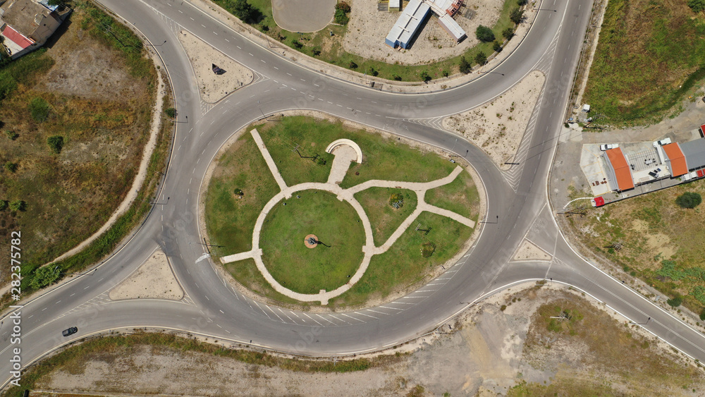 Aerial drone photo of modern motorway roundabouts of Ionia Odos near famous cable bridge of Rio - Antirio Harilaos Trikoupis, Antirio, Greece Aerial drone photo of modern motorway roundabouts of Ionia Odos near famous cable bridge of Rio - Antirio Harilaos Trikoupis, Antirio, Greece