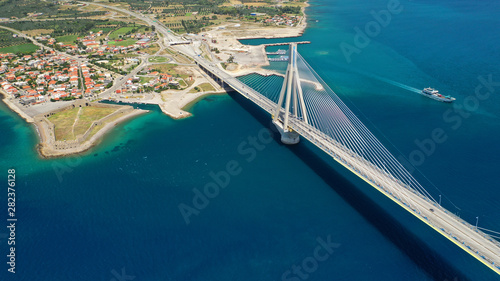 Aerial drone photo of world famous cable suspension bridge of Rio - Antirio Harilaos Trikoupis, crossing Corinthian Gulf, mainland Greece to Peloponnese, Patras photo