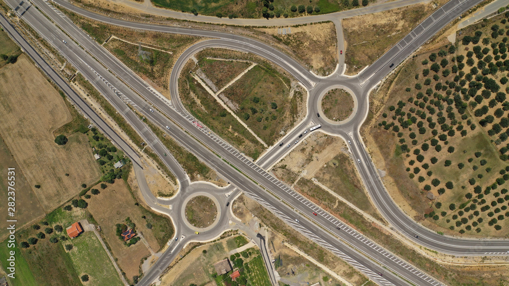 Aerial drone top view photo of modern roundabout as seen in low traffic motorway outside city centre Aerial drone top view photo of modern roundabout as seen in low traffic motorway outside city centre