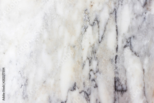 Natural texture of marble black switching white and yellow for patterned texture and background. © nayladen