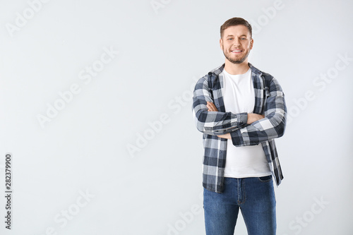 Handsome young man on light...