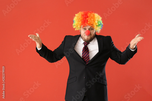 Funny businessman in clown ...