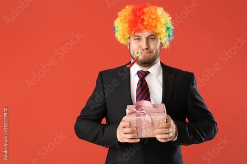 Funny businessman in rainbo...