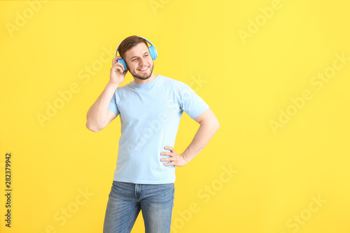 Handsome young man listenin...