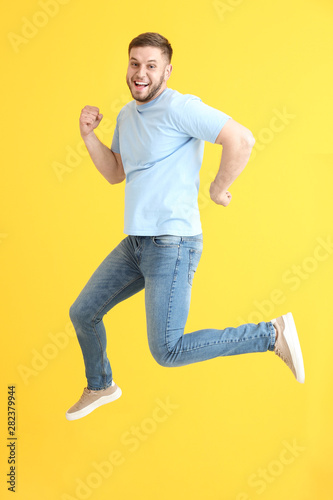 Handsome jumping young man ...