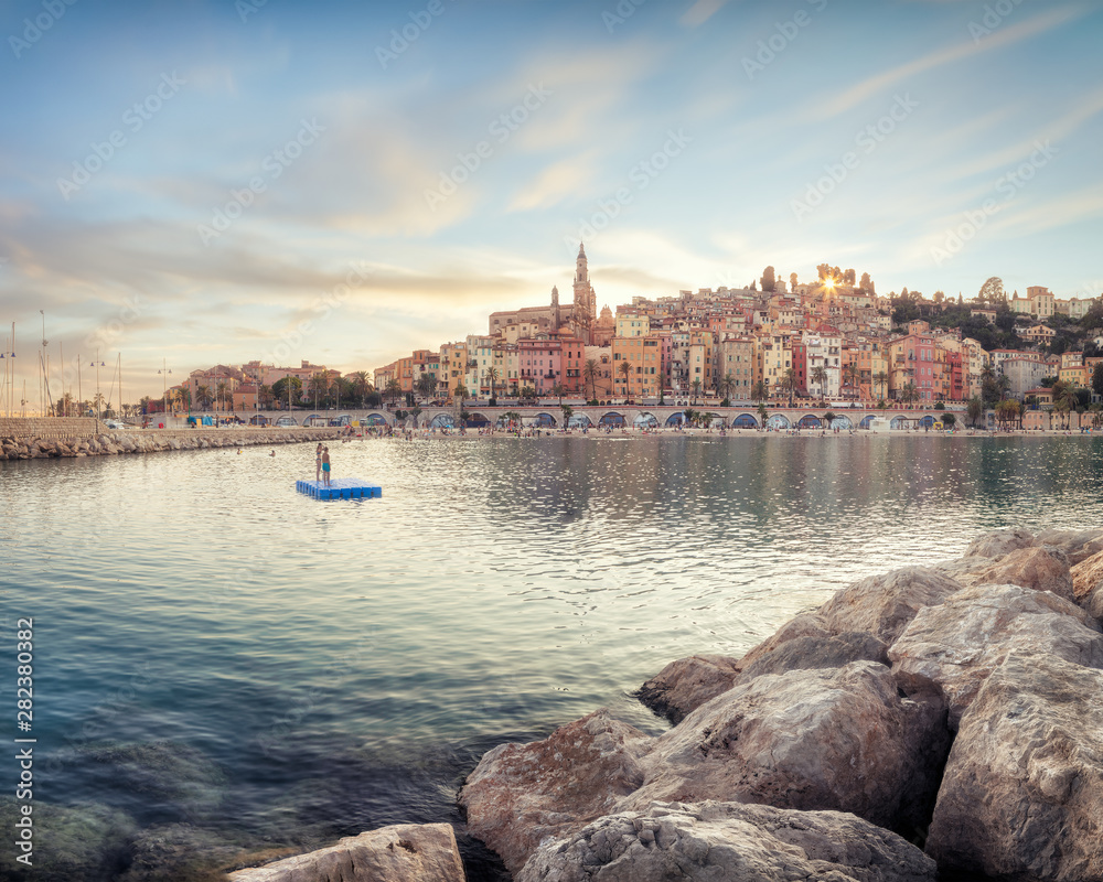 Fototapeta premium Public beach of Menton old town at sunset