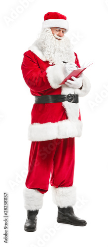 Santa Claus with notebook on white background