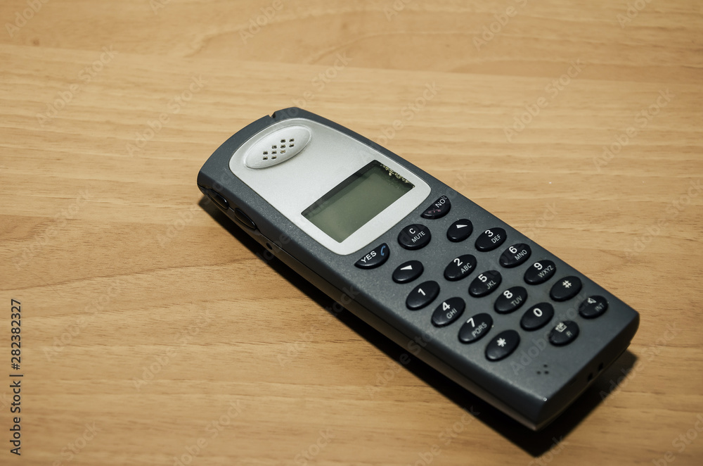 office cordless telephone on the table. Close-up. office cordless telephone on the table. Close-up.