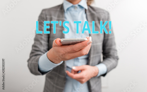 Word writing text Let S Talk. Business photo showcasing they are suggesting beginning conversation on specific topic Business concept with mobile phone and business woman