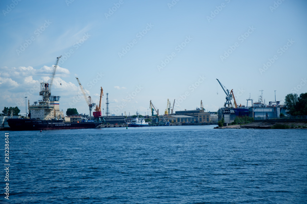 port cranes for unloading ships in a river port