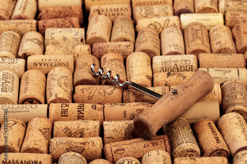 Closeup pattern background of many different wine corks with dates and drops of wine - Image photo