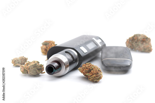 CBD and THC vaping products, dry herb vaporizer and healthy inhaling of cannabis concept theme with e cigarette and vape mod surrounded by marijuana buds isolated on white background photo