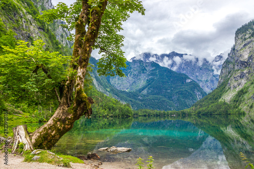 clouds over mountain lake Obersee in Alps