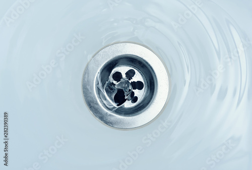 Water flow into drain in bath