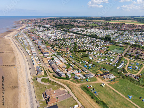 Aerial photo of the British seaside town of Hunstanton in Norfolk showing the coastal area and beach and alsop the caravan holiday park.