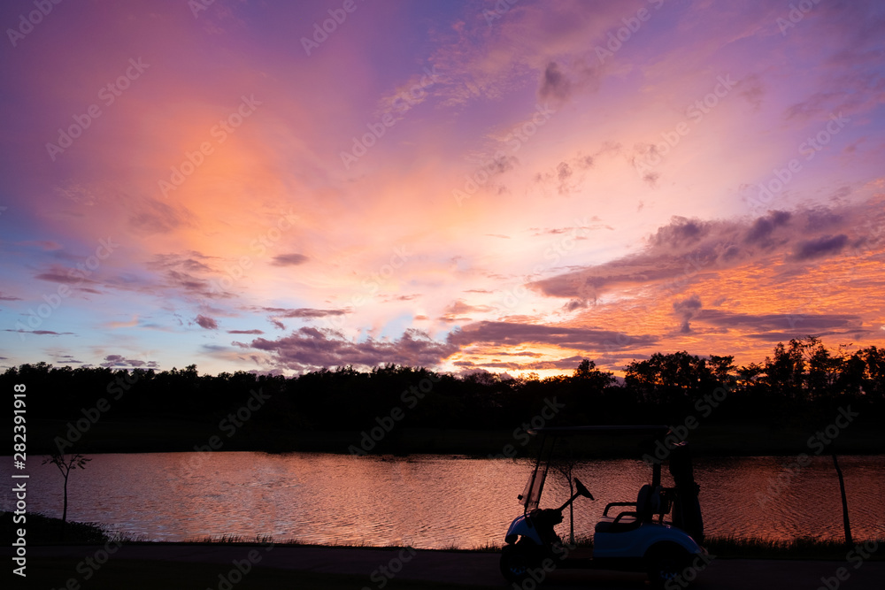 silhouette golf cart in golf course with colorful twilight sky soft cloud for background backdrop use silhouette golf cart in golf course with colorful twilight sky soft cloud for background backdrop use