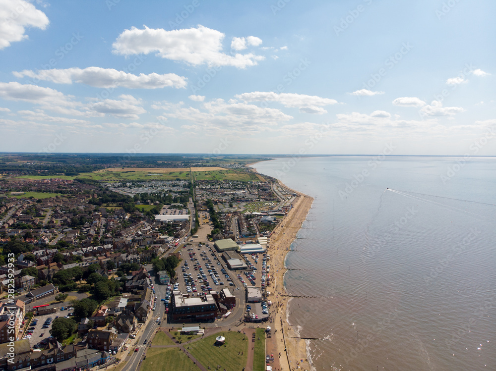 Fototapeta premium Aerial photo of the British seaside town of Hunstanton in Norfolk showing the coastal area and beach and alsop the caravan holiday park.