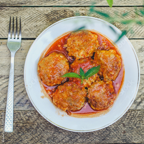 meatballs, tasty meat dish (ground meat, tomato sauce, vegetables) falafel. top food background. copy space