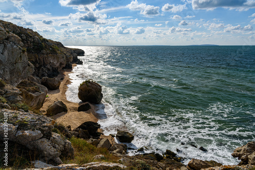 The beaches of the generals of the Crimean peninsula in cloudy weather, on a sleepy day with clouds in the sky, shot during the season of golden autumn and yellow-golden brown. photo