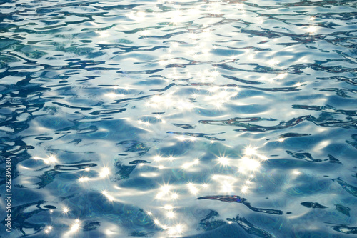 Pool water with sun glare on the surface