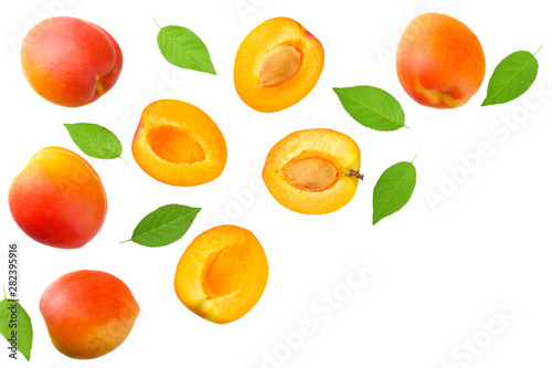 apricot fruits with slices and green leaf isolated on white background. top view