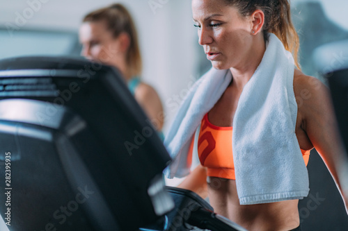 Women Exercising on Treadmill. © Microgen