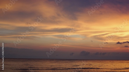 picturesque Pink sunset on lake beach sea sand beautiful colors in the sky clouds