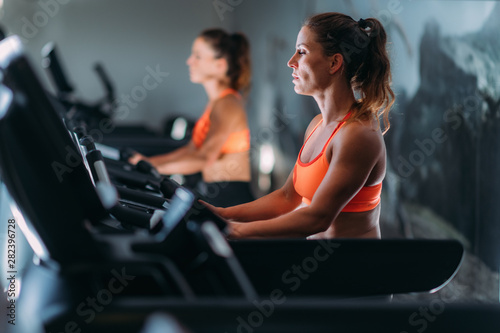 Woman Exercising on Cycling Machine © Microgen