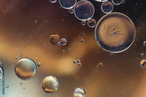 Dark brown abstract background with bubbles