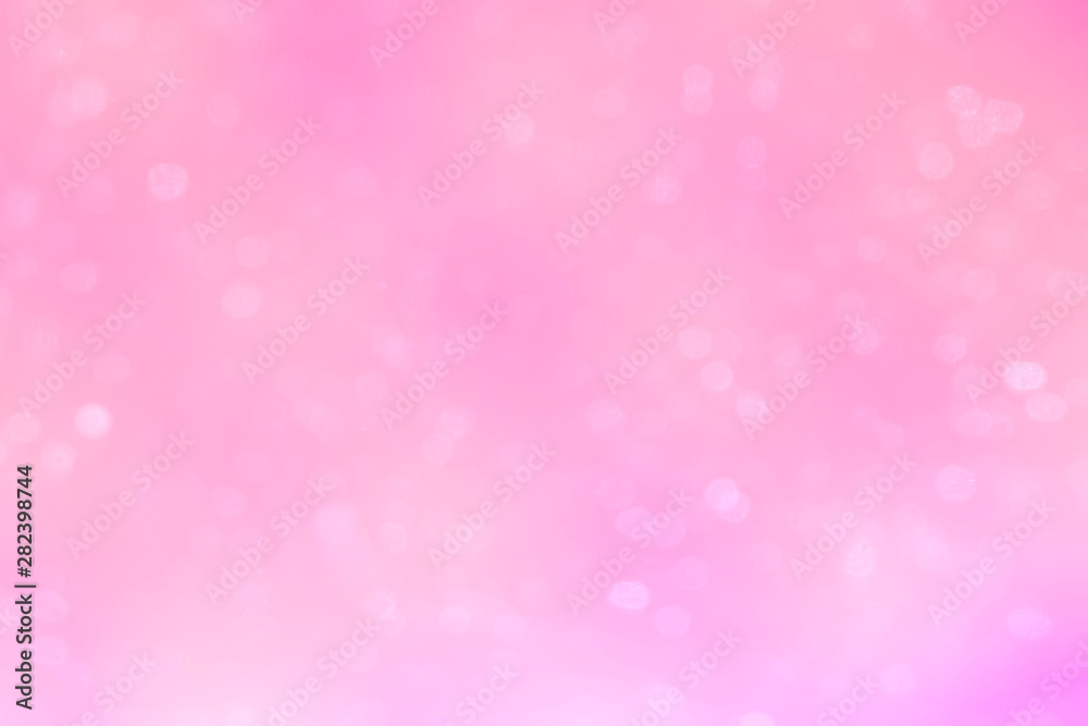 Abstract white bokeh on the pink glowing background