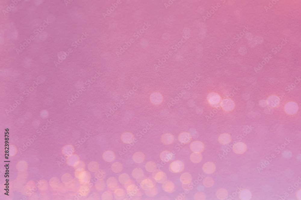 Abstract blurred light bokeh on pink background