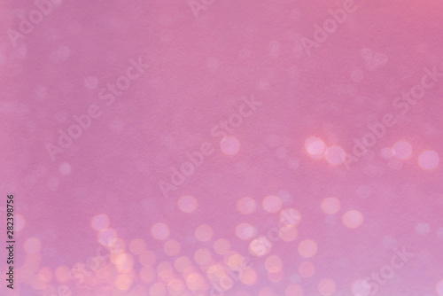 Abstract blurred light bokeh on pink background