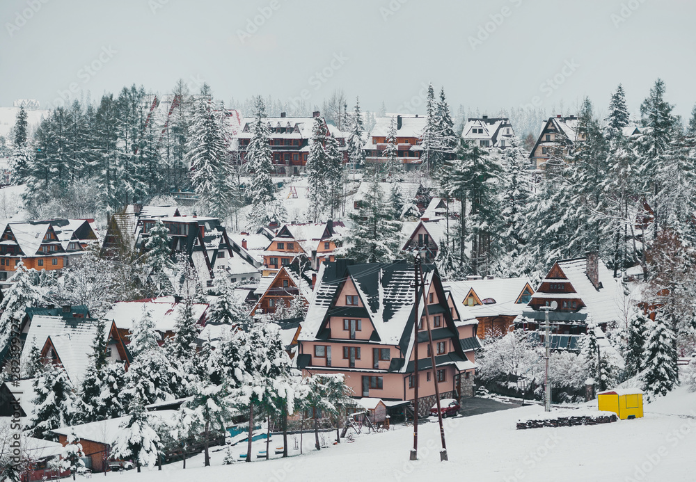 Tatra mountain landscape of zakopane with wooden cottages. Panoramic beautiful winter landscape view.
