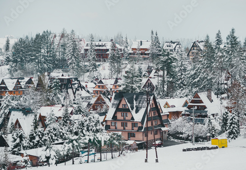 Tatra mountain landscape of zakopane with wooden cottages. Panoramic beautiful winter landscape view. © Irina84
