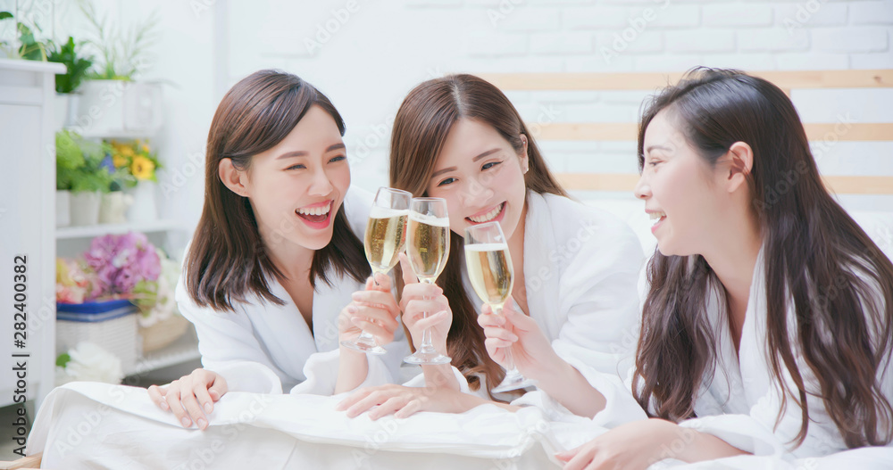 asian women friend have champagne - obrazy, fototapety, plakaty 