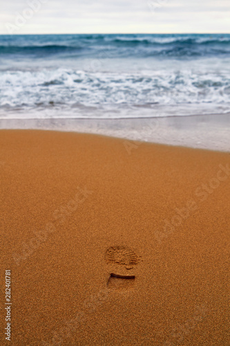 Summer sandy beach with footprint photo